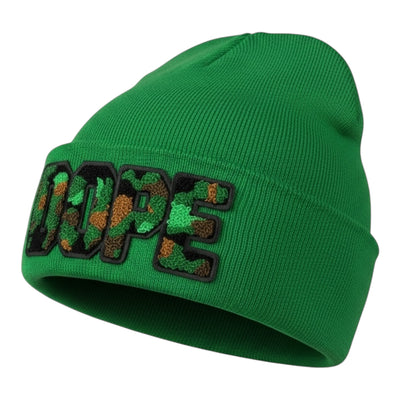 Green beanie with 'DUPE' text on a white background