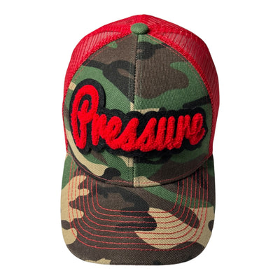 Camouflage cap with red mesh back and 'Pressure' text on a white background