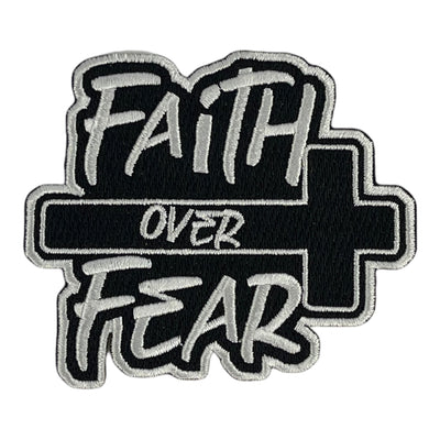 A premium embroidered iron on patch with the text 'FAITH OVER FEAR' designed in a black and gray color scheme with a cross symbol.