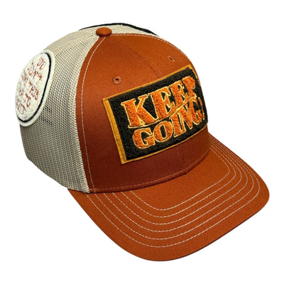 Brown and beige cap with 'Keep Going' patch on a white background