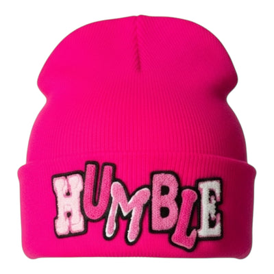 Pink beanie with 'HUMBLE' text on a white background