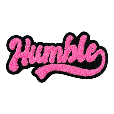 Pink 'Humble' patch with black border on white background