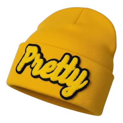 Yellow beanie with 'Pretty' text on a white background