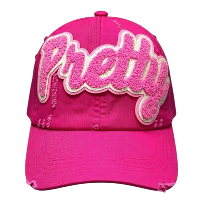 Pink cap with 'Pretty' text on a white background