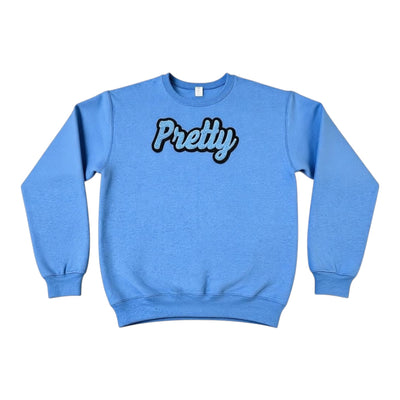 Blue sweatshirt with 'Pretty' text on a white background