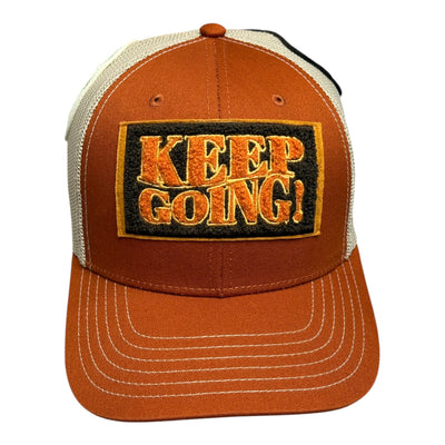 Orange cap with 'KEEP GOING!' patch on a white background